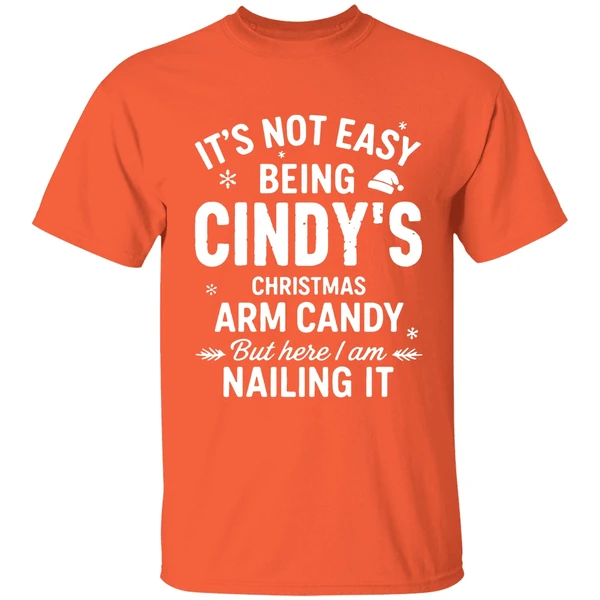 its-not-easy-being-cindys-christmas-arm-candy-but-here-i-am-nailing-it-shirt-orange